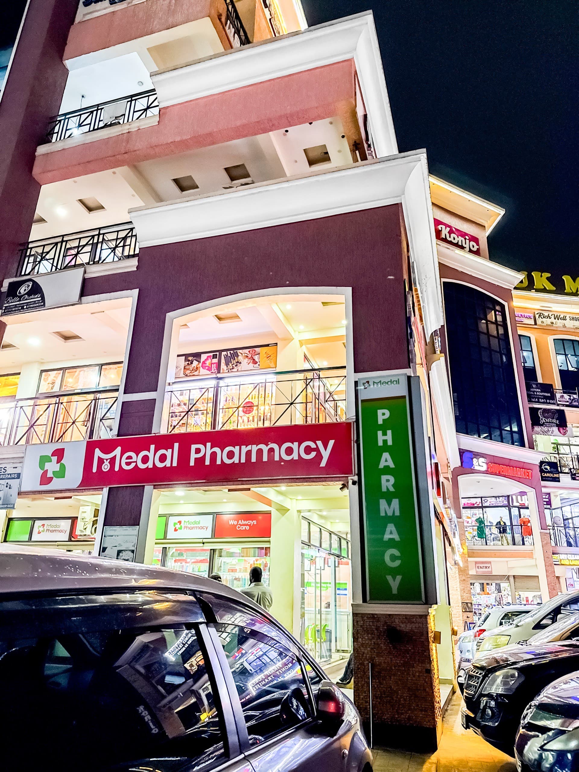 Medal Pharmacy storefront at UK Mall, Kansanga